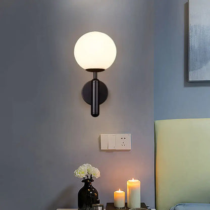 Black Gold Glass Globe Sconce by Decorbites; black metal wall light with white globe on Tampa Home & Garden Store