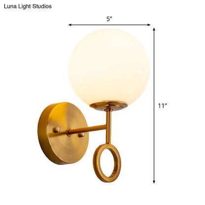 Brass Cream Glass Sconce by Decorbites with frosted globe and ring accent on Tampa Home & Garden Store