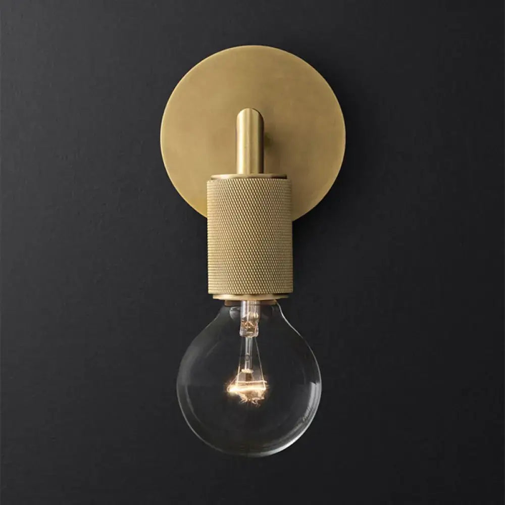 Bronze Glass Wall Sconce with knurled gold socket and exposed bulb on dark wall on Tampa Home & Garden Store