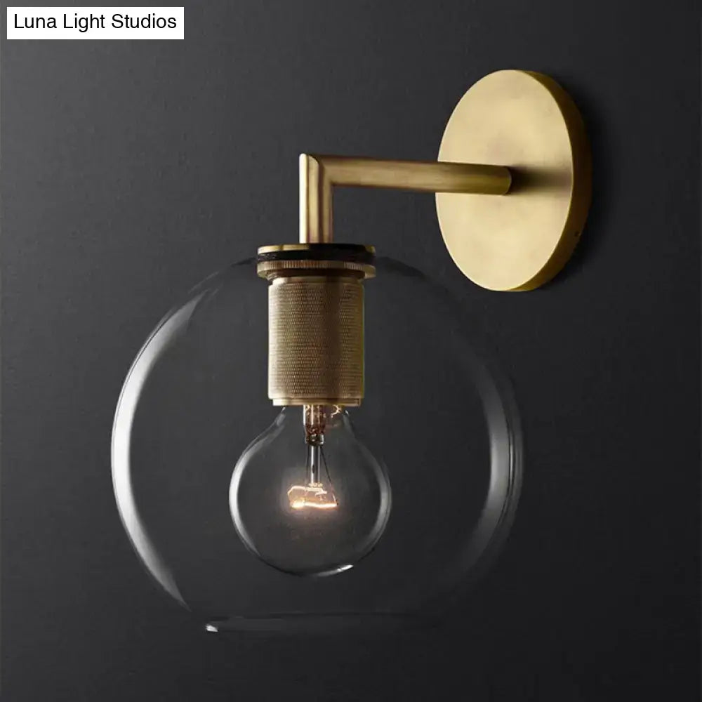 Bronze glass wall sconce with brass mount and clear globe bulb by Decorbites on Tampa Home & Garden Store