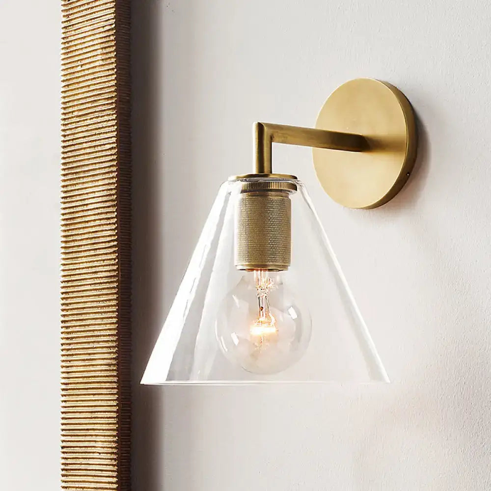 Bronze glass wall sconce by Decorbites with clear conical shade and brass wall mount on Tampa Home & Garden Store