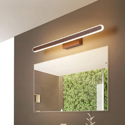 Brown LED vanity sconce, Decorbites wood-finish linear bar light above bathroom mirror on Tampa Home & Garden Store