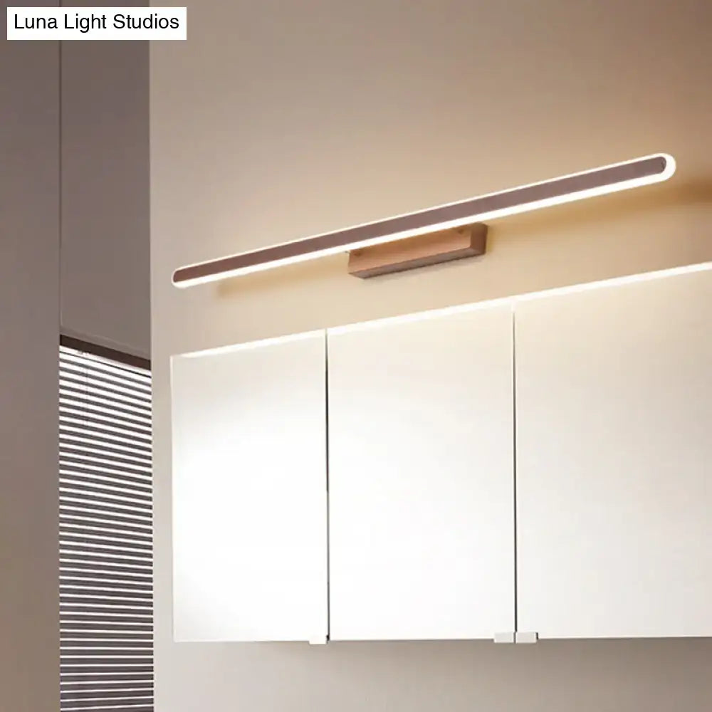 Decorbites brown wooden LED vanity sconce with wall mount over white cabinets on Tampa Home & Garden Store