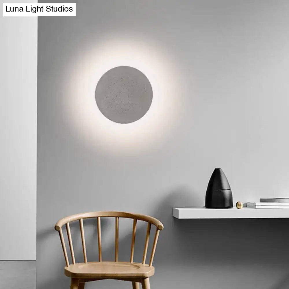 Grey Cement Wall Sconce by Decorbites, circular cement disc with soft glow on Tampa Home & Garden Store