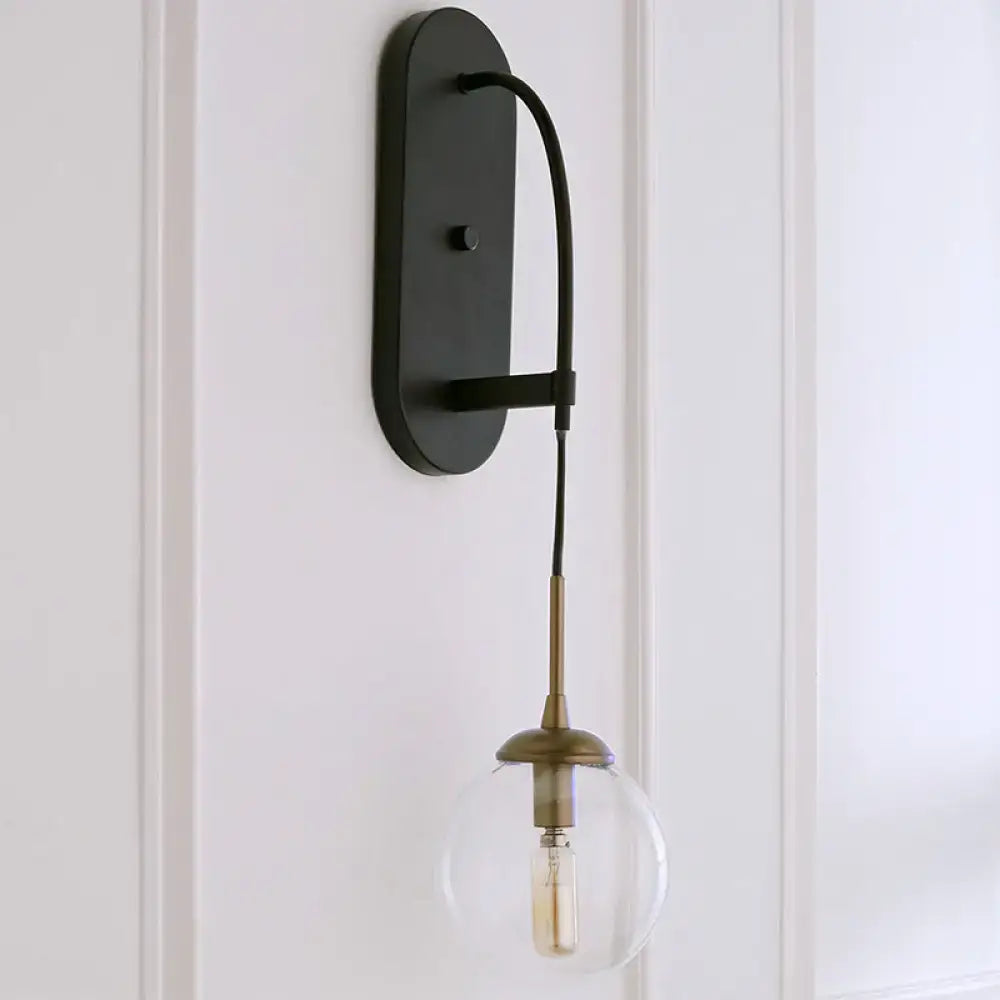 Black Glass Wall Sconce with oval backplate curved arm brass socket Edison bulb on Tampa Home & Garden Store