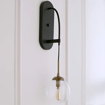 Black Glass Wall Sconce with oval backplate curved arm brass socket Edison bulb on Tampa Home & Garden Store