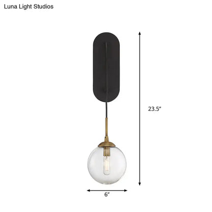 Black Glass Wall Sconce Industrial Aesthetic with black backplate, clear glass globe Decorbites on Tampa Home & Garden Store