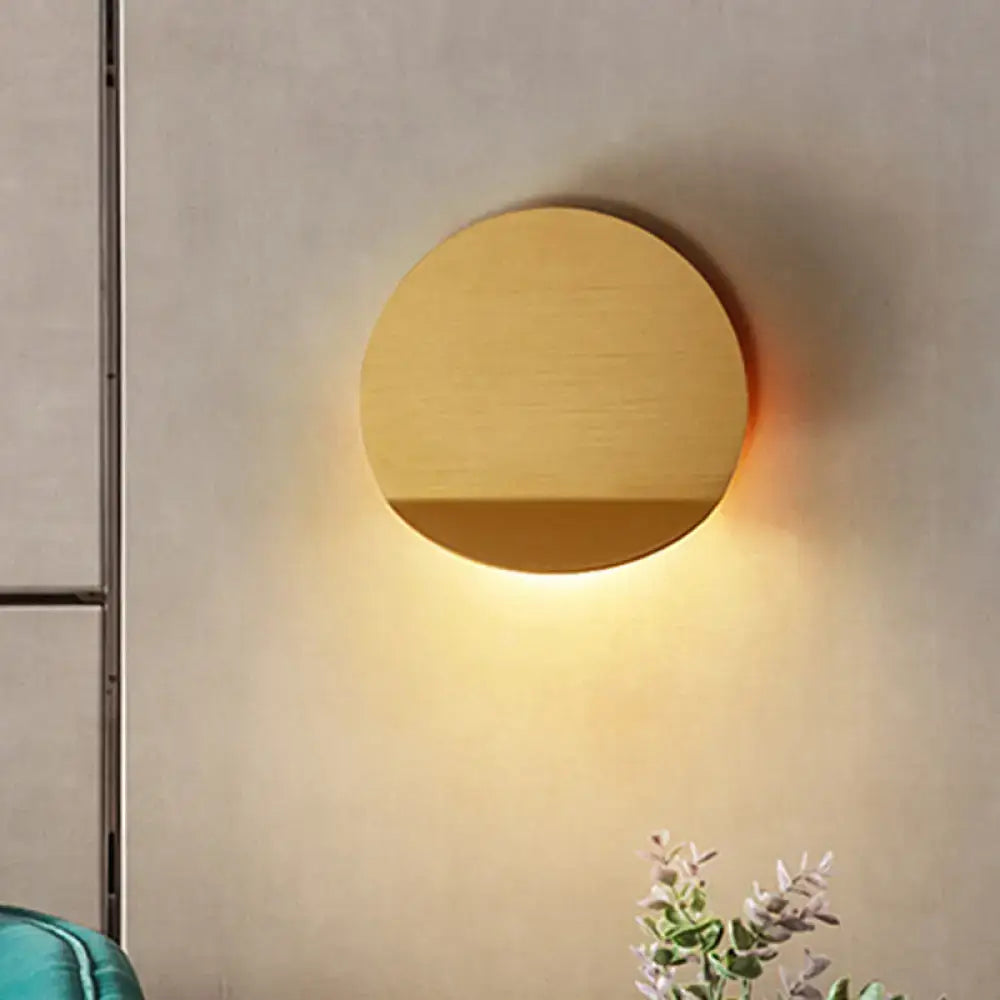 Copper wall sconce light by Decorbites, round disk design with warm downward glow on Tampa Home & Garden Store