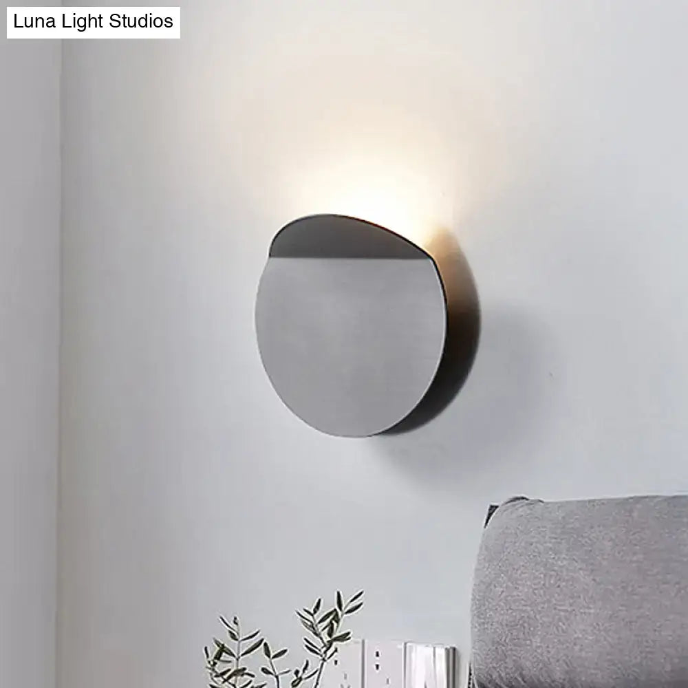Copper wall sconce light by Decorbites, circular brushed metal disc with upward glow on wall on Tampa Home & Garden Store