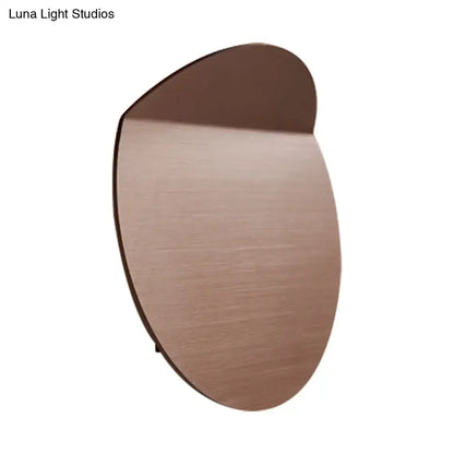 Copper wall sconce light with round brushed copper disc silhouette on Tampa Home & Garden Store