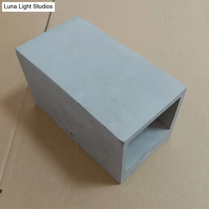 Grey cement wall light with a rectangular front opening; cement block style by Decorbites on Tampa Home & Garden Store