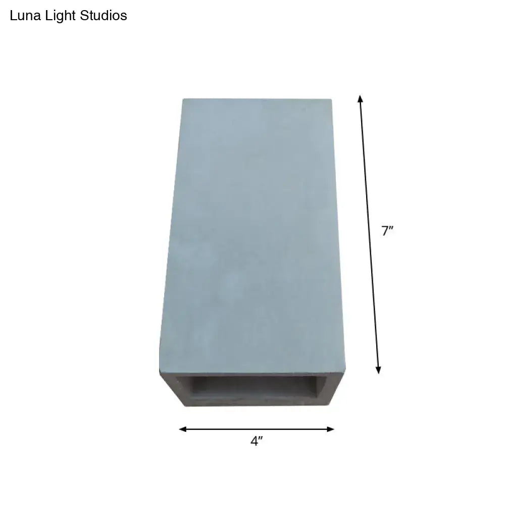 Grey cement wall light sconce with open-bottom design, 7in tall by 4in wide on Tampa Home & Garden Store