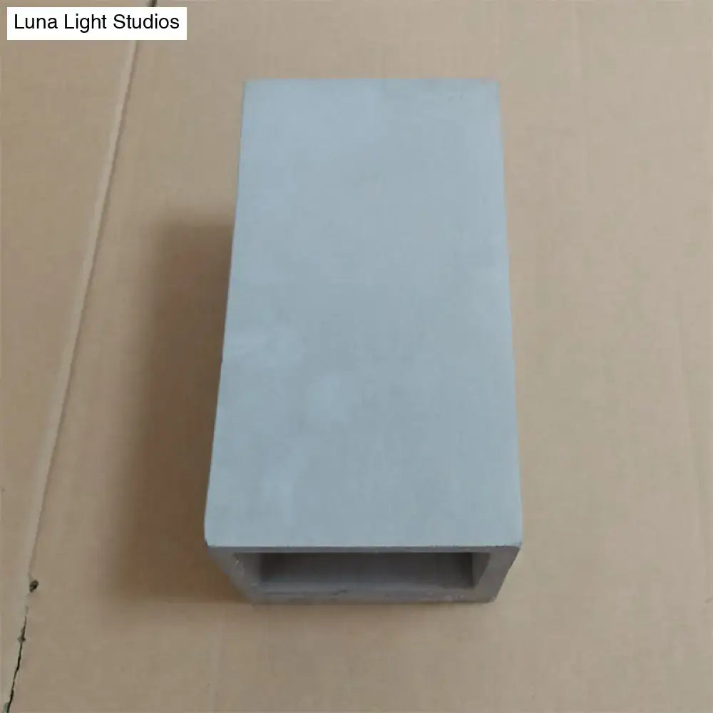 Grey cement wall light by Decorbites, rectangular block with open bottom channel on Tampa Home & Garden Store