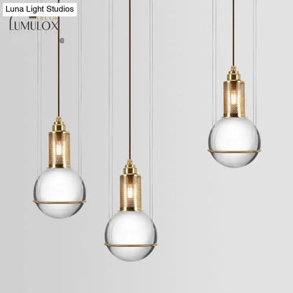 Brass crystal globe pendant lights by Decorbites, set of 3 with glass spheres and gold caps on Tampa Home & Garden Store