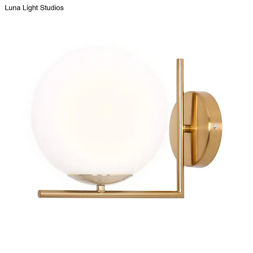Gold frosted glass ball compact sconce with brass mount by Decorbites on Tampa Home & Garden Store