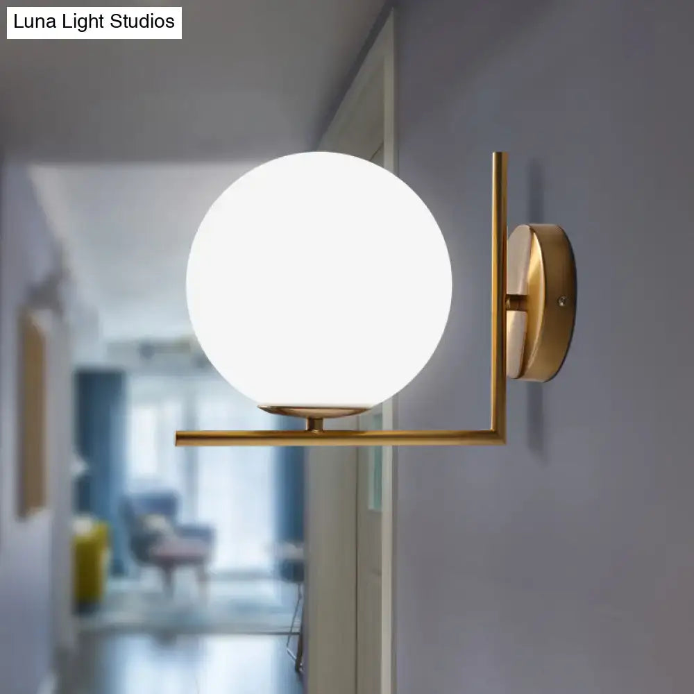 Gold frosted glass ball compact sconce with brass frame, Decorbites wall light on Tampa Home & Garden Store