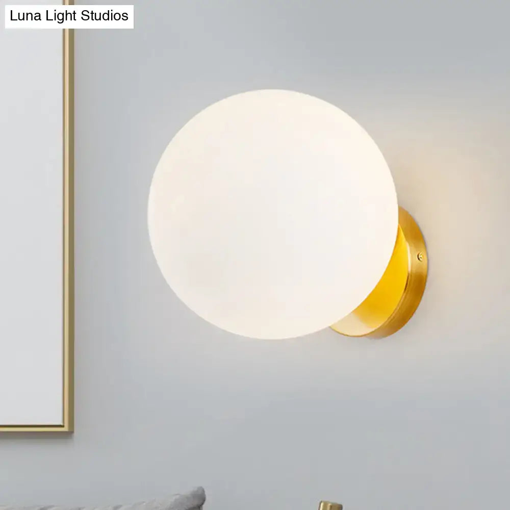 Gold and white glass wall sconce with LED bulb by Decorbites on Tampa Home & Garden Store