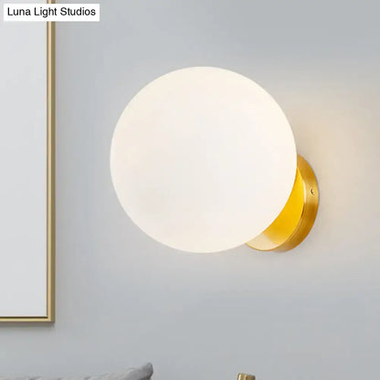 Gold and white glass wall sconce with LED bulb by Decorbites on Tampa Home & Garden Store