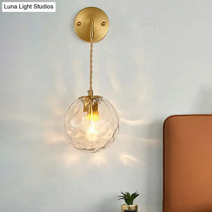 Gold hammered glass sconce pendant with brass backplate and twisted cord by Decorbites on Tampa Home & Garden Store