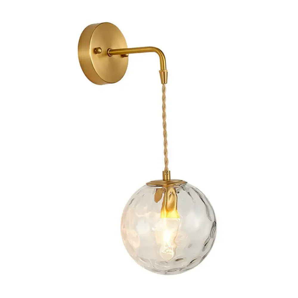 Gold hammered glass sconce by Decorbites, wall-mount curved arm with glass globe on Tampa Home & Garden Store