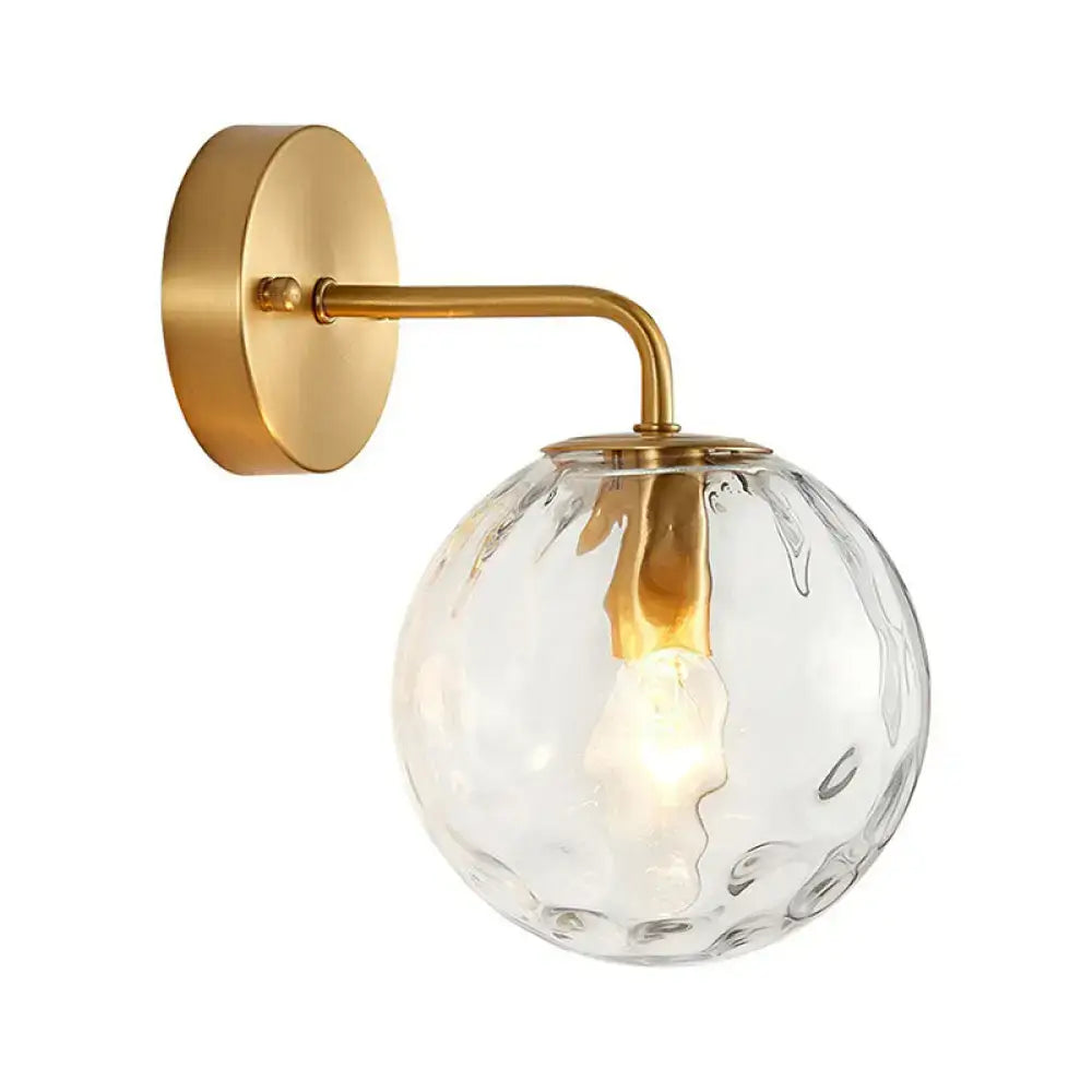 Gold Hammered Glass Sconce with brass wall mount and clear glass globe on Tampa Home & Garden Store