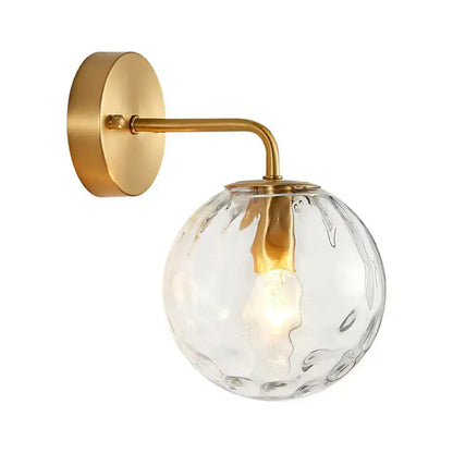 Gold Hammered Glass Sconce with brass wall mount and clear glass globe on Tampa Home & Garden Store