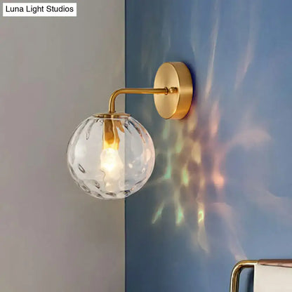 Gold hammered glass sconce with brass wall-mount and clear globe shade by Decorbites on Tampa Home & Garden Store