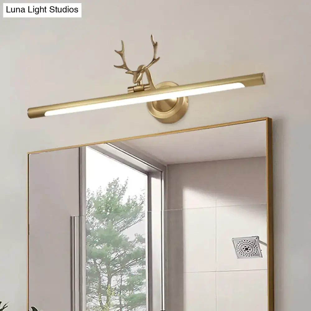 Gold Antler Wall Sconce by Decorbites with brass horizontal light bar above a round wall mount on Tampa Home & Garden Store