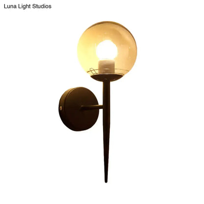 Gold Black Glass Sconce with amber globe, black wall mount and tapered stem on Tampa Home & Garden Store