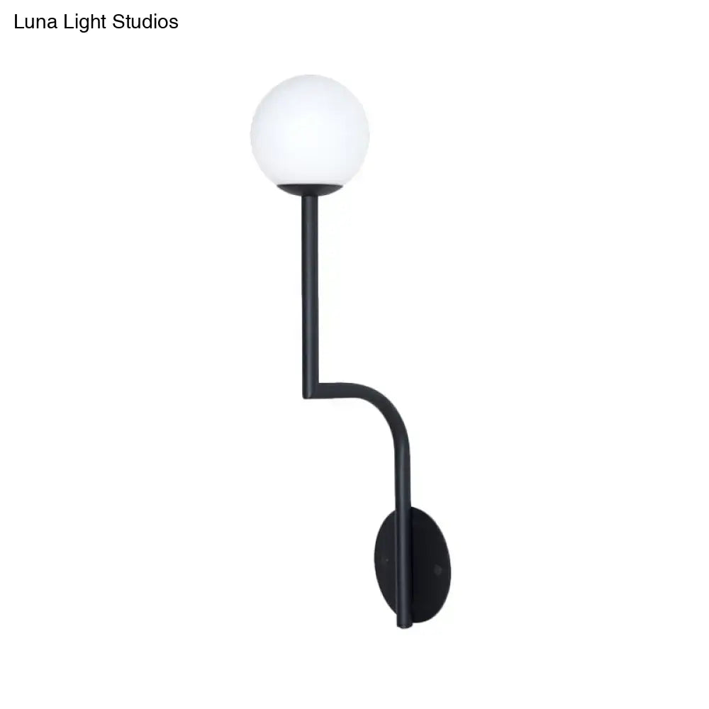 Opal glass curved sconce with black metal arm and circular wall mount on Tampa Home & Garden Store