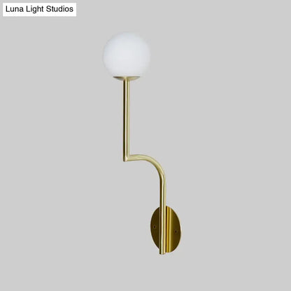 Opal Glass Curved Sconce with brass arm and white glass globe wall mount by Decorbites on Tampa Home & Garden Store