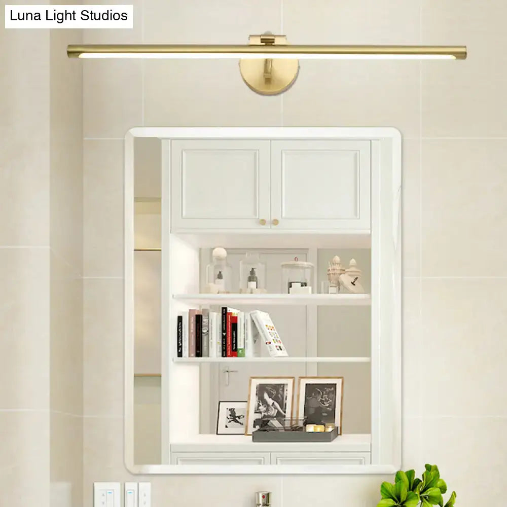 Brass LED vanity sconce bar light by Decorbites mounted above a white bathroom mirror cabinet on Tampa Home & Garden Store