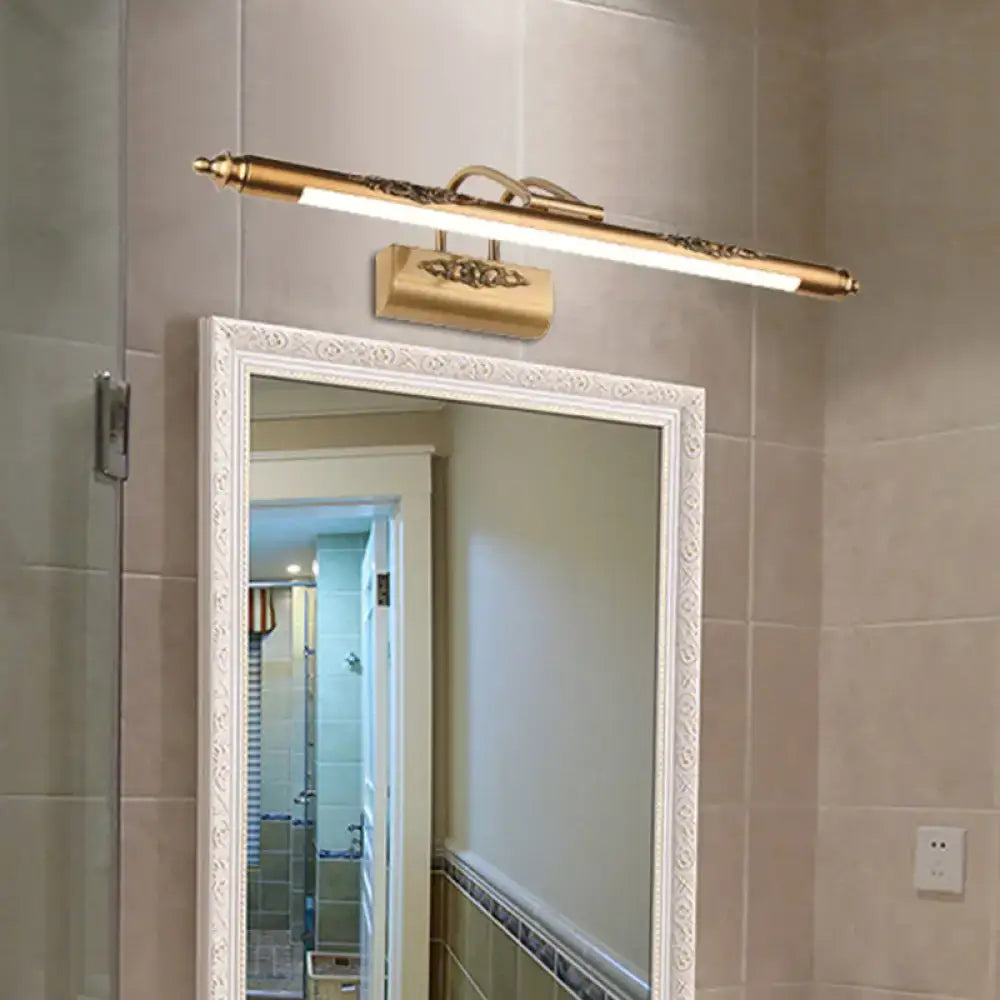 Brass wide LED vanity light by Decorbites above a white ornate-framed bathroom mirror on Tampa Home & Garden Store