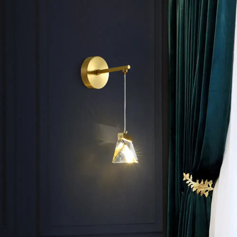 Gold crystal polyhedron wall lamp with round gold mount and hanging prism shade on Tampa Home & Garden Store