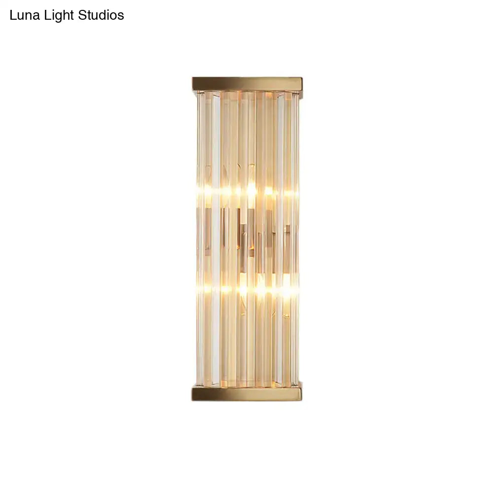 Gold crystal E12 sconce with vertical glass prisms and warm glow on Tampa Home & Garden Store