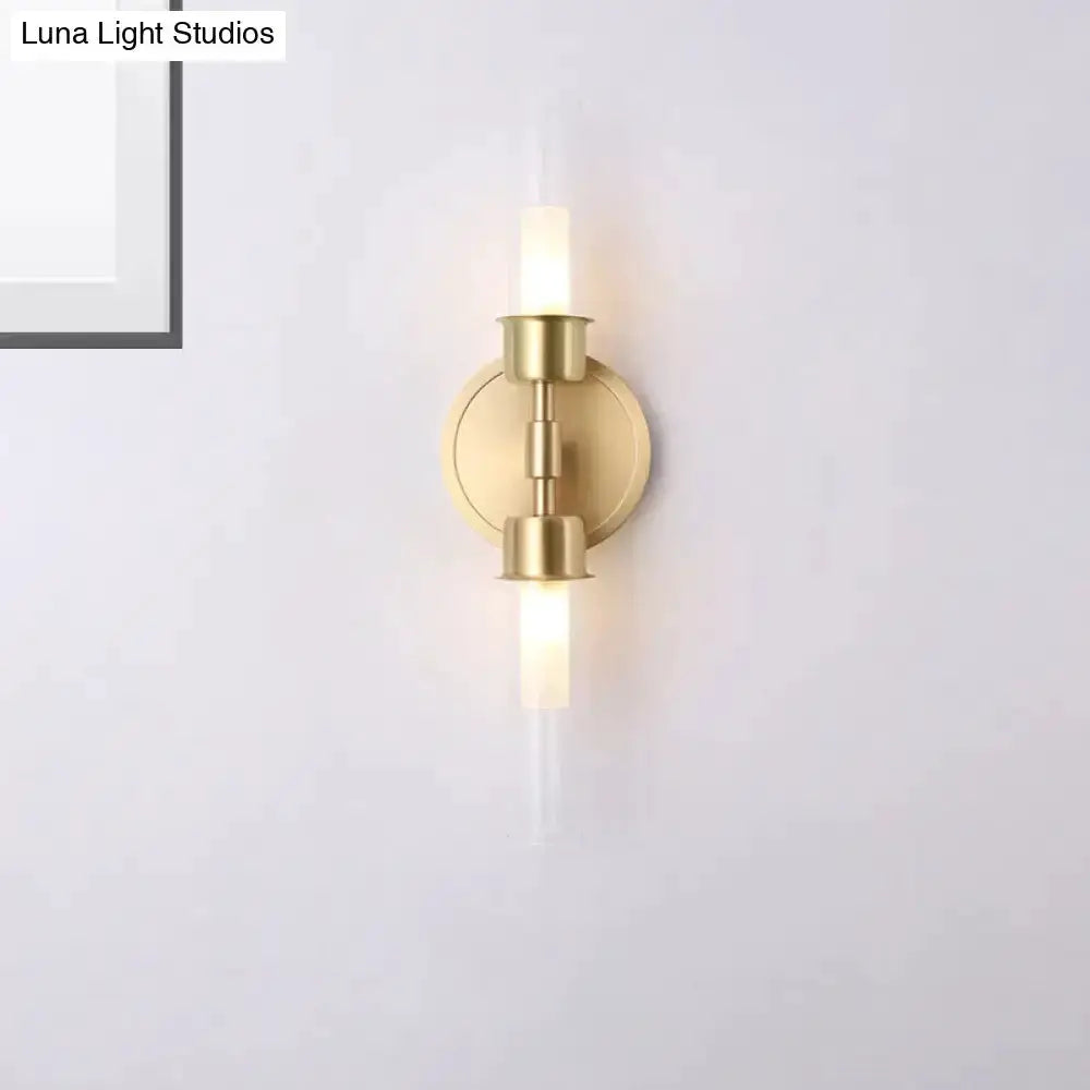 Decorbites gold double-cylinder wall sconce two-light fixture with round backplate on Tampa Home & Garden Store