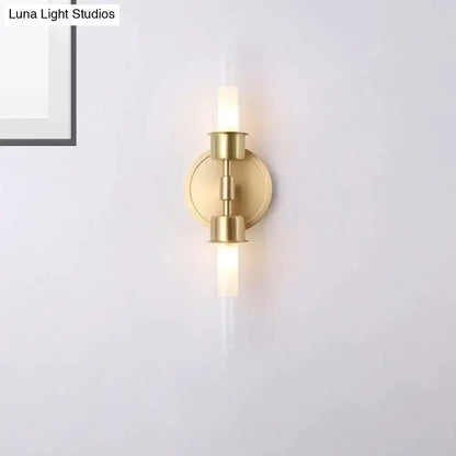 Decorbites gold double-cylinder wall sconce two-light fixture with round backplate on Tampa Home & Garden Store
