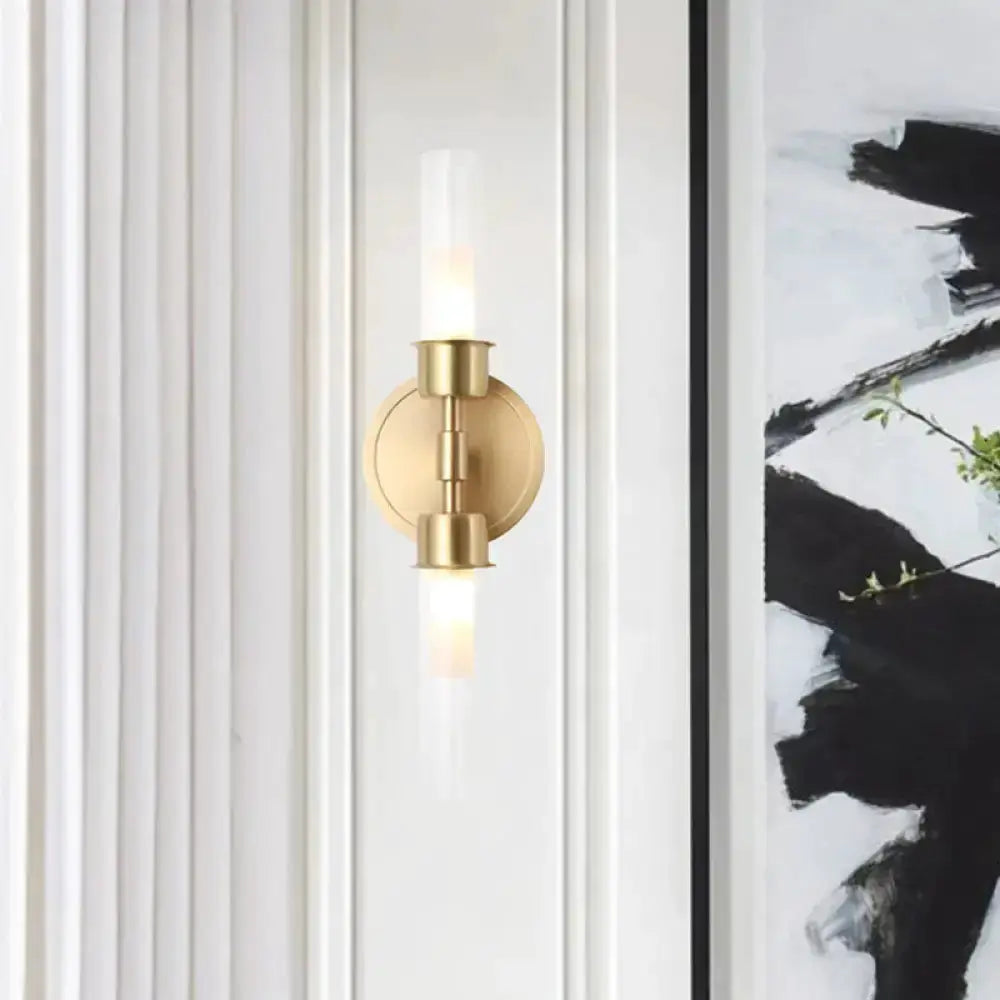 Minimalist gold double cylinder wall sconce, 2-light fixture with round backplate on Tampa Home & Garden Store