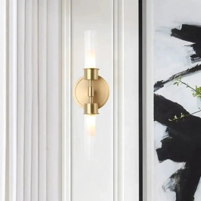 Minimalist gold double cylinder wall sconce, 2-light fixture with round backplate on Tampa Home & Garden Store