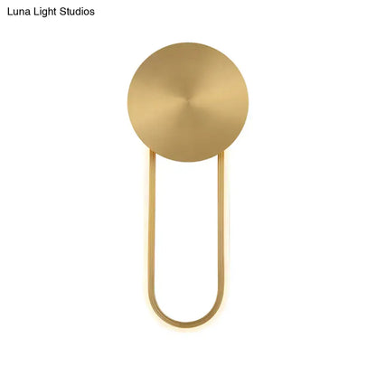Gold elliptical wall sconce with round backplate and U-shaped arm by Decorbites on Tampa Home & Garden Store