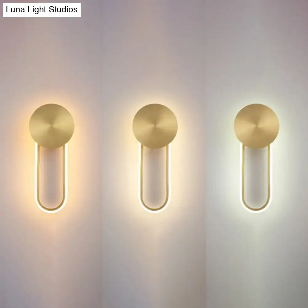 Gold elliptical wall sconces trio with circular backplates and U-shaped LED light tubes on Tampa Home & Garden Store