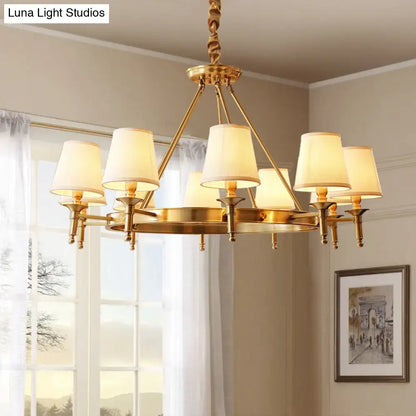 Gold fabric ceiling chandelier with cream lampshades and eight lights on Tampa Home & Garden Store