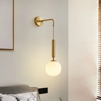 Gold cream glass wall sconce with brass arm by Decorbites on Tampa Home & Garden Store