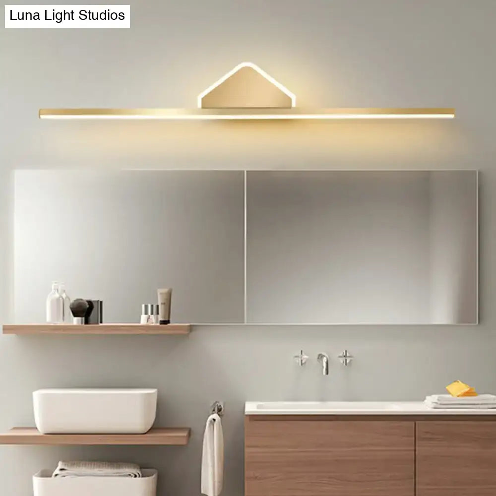 Gold-tone LED Linear Semicircle Vanity Light above a modern mirror with warm glow on Tampa Home & Garden Store