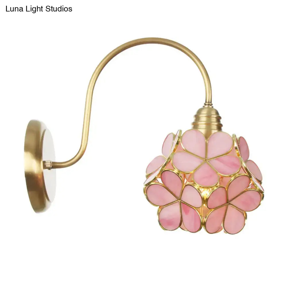 Gold floral glass wall sconce with pink petal shade and brass arm, rotating shade on Tampa Home & Garden Store