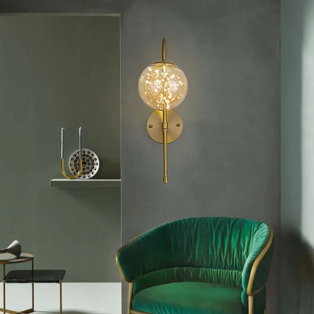 Gold gooseneck wall light with glass orb and brass mount by Decorbites on Tampa Home & Garden Store