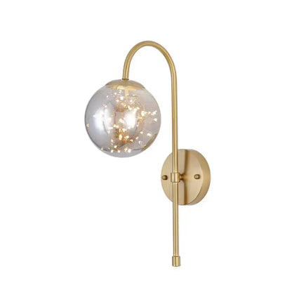 Decorbites gold gooseneck wall light with clear glass globe and string lights on Tampa Home & Garden Store