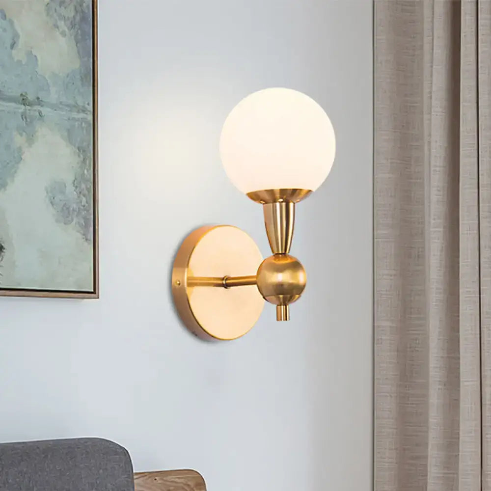 Gold Hand Blown Sconce by Decorbites with brass finish and frosted glass globe, wall mount on Tampa Home & Garden Store