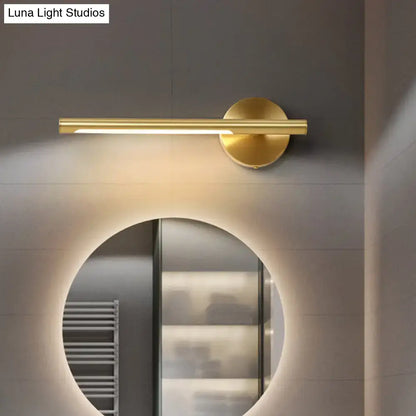 Gold LED wall light metal fixture with cylindrical bar on round mount on Tampa Home & Garden Store