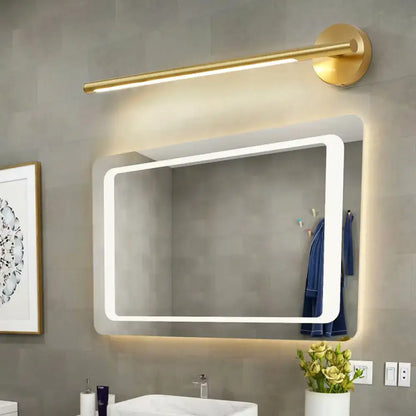 Gold LED wall light by Decorbites over a modern backlit bathroom mirror on Tampa Home & Garden Store